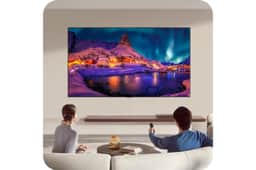 77-Inch LG OLED TV OLED77G6WUA displaying vibrant northern lights scene with snowy village in modern living room setting - Lifestyle View