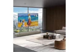 83-Inch LG OLED W6 TV OLED83W6PUA displaying fine art in modern living room with floor-to-ceiling windows and city view - Lifestyle