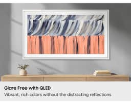 Samsung 65" The Frame LS03HE QLED 4K Art TV (2026) QN65LS03HEFXZA – A lifestyle shot showing The Frame LS03HE's Glare Free technology at work in a living room in front of a window during the daytime